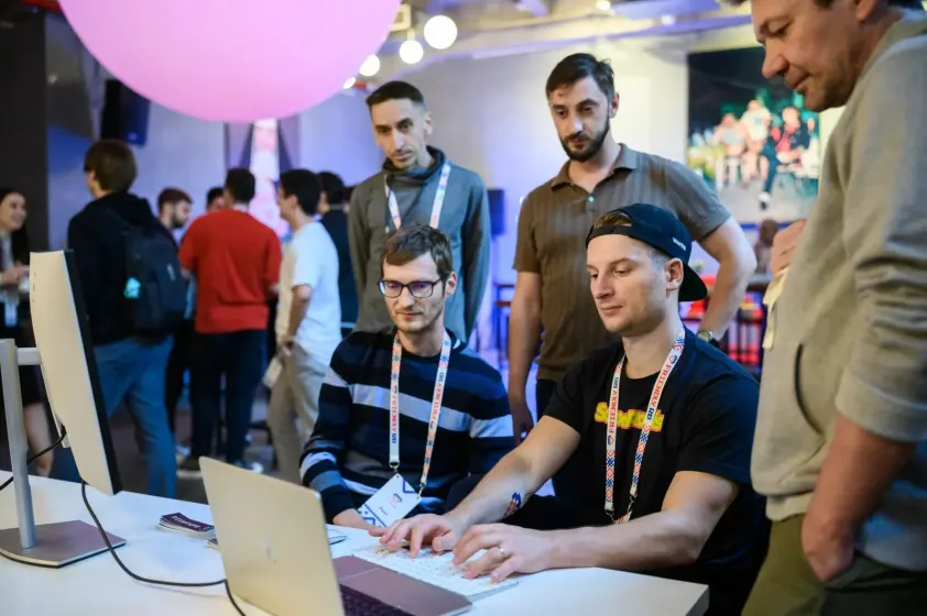Attendees pairing on a laptop in the Hack Space